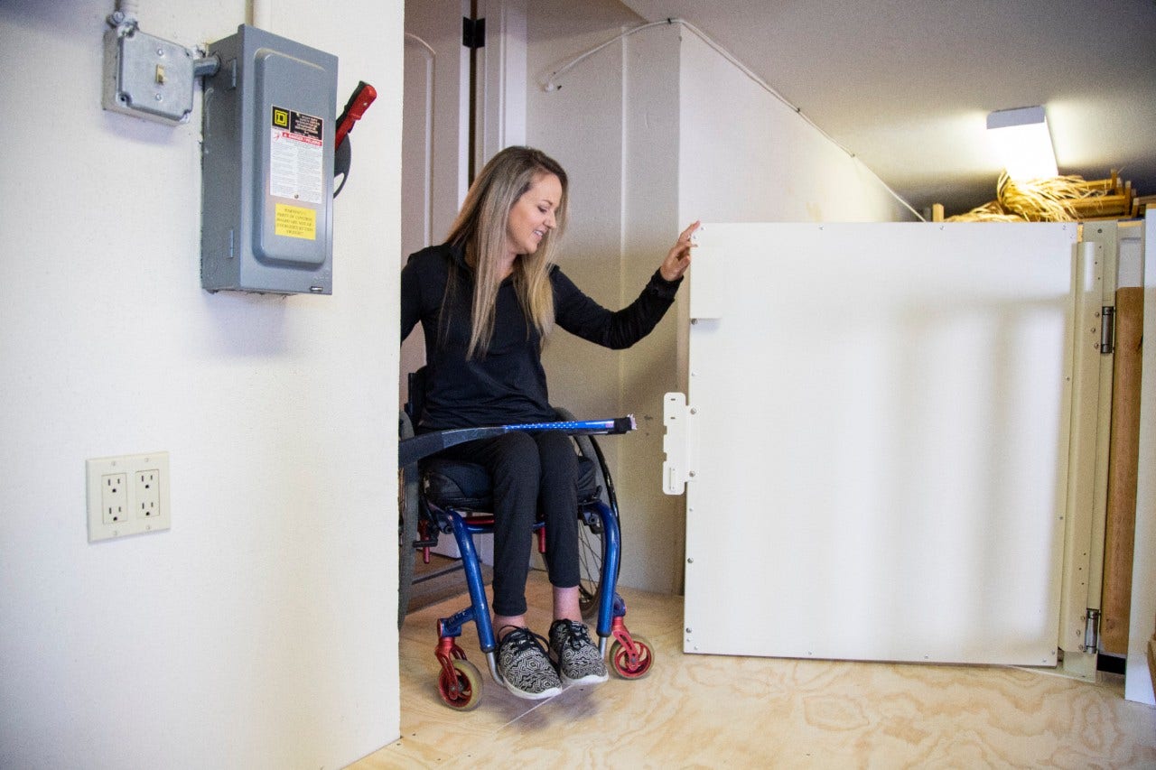 Harmar Highlander Vertical Platform Lift woman entering lift