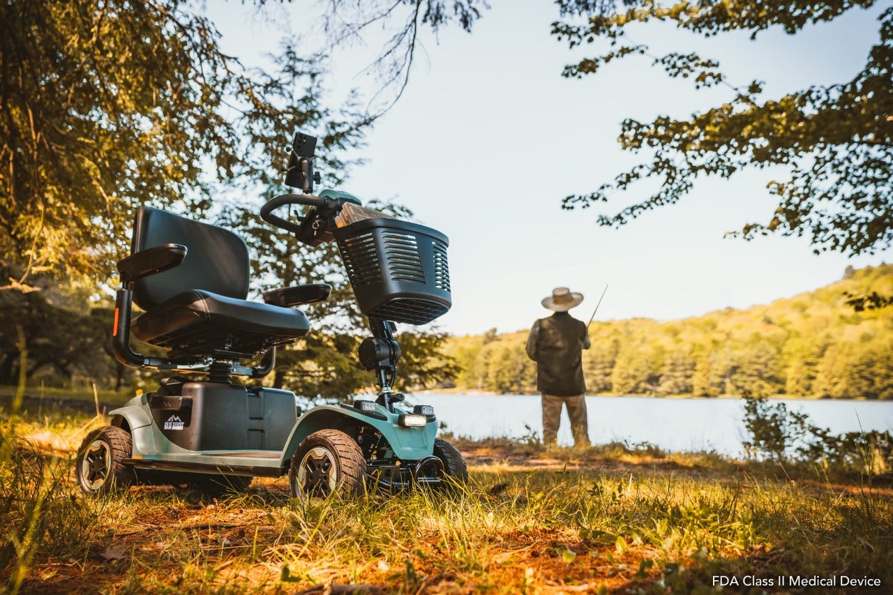 man fishing with scooter in front