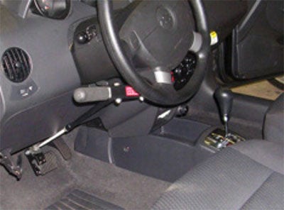 Creative Controls Hand Controls for Driving installed steering wheel