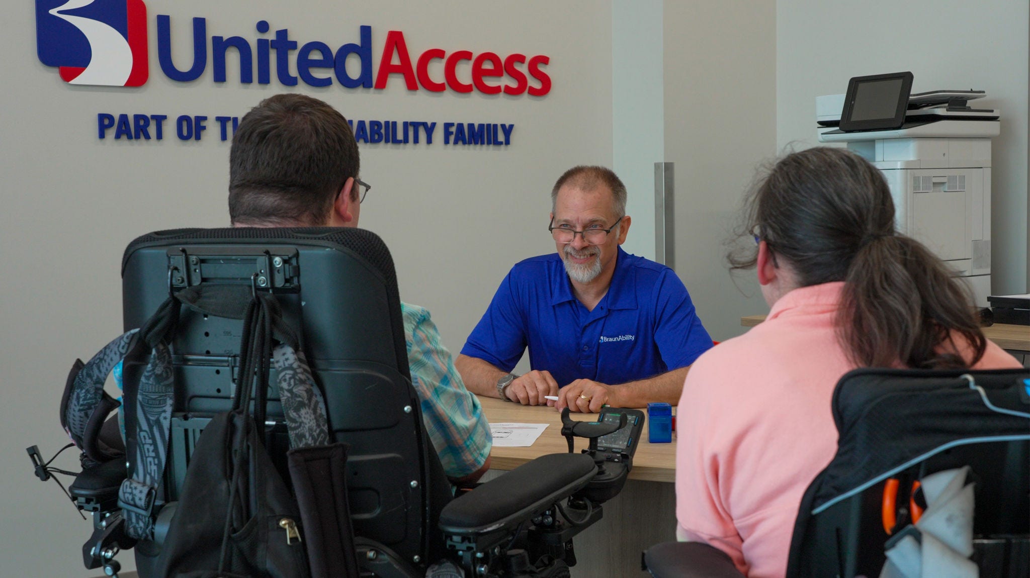 mobility specialist sitting at desk