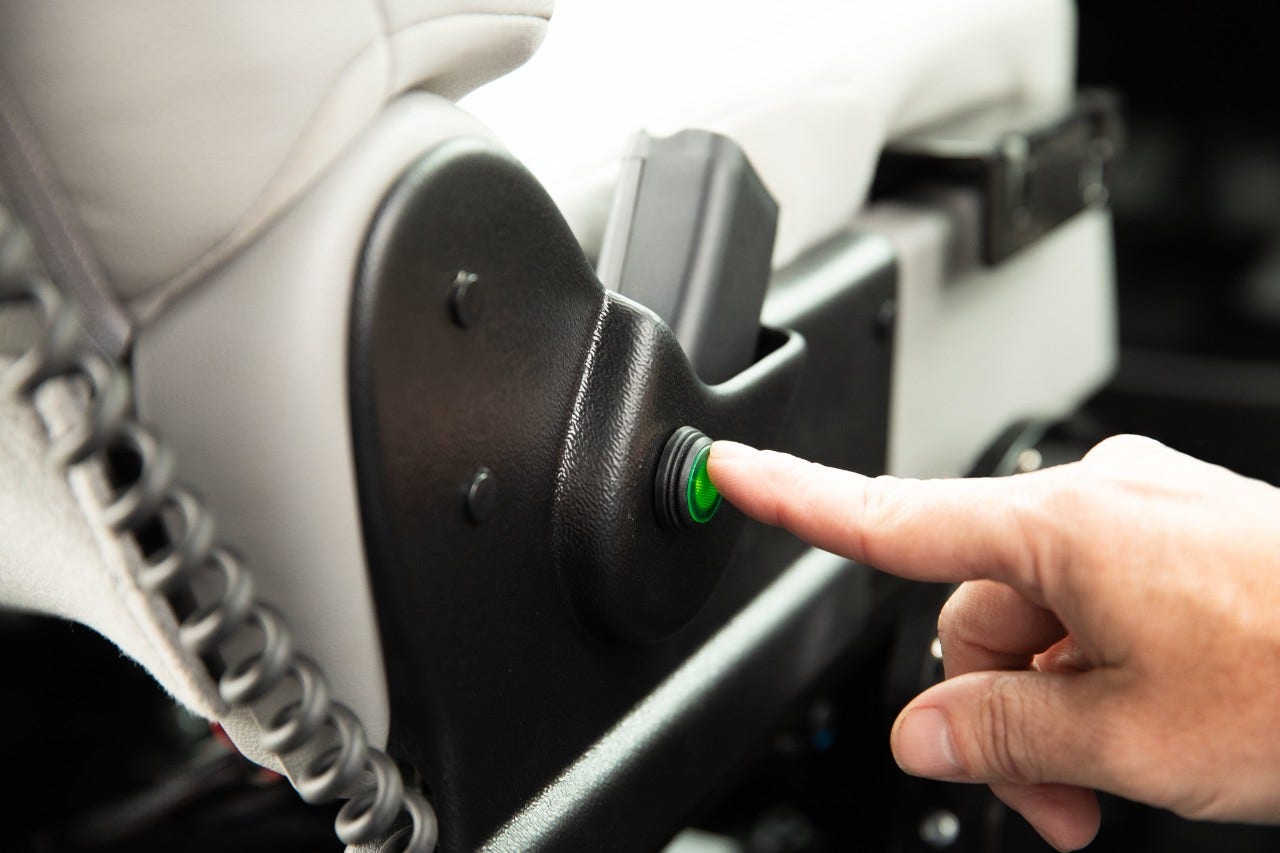 BraunAbility unoccupied wheelchair restraint button