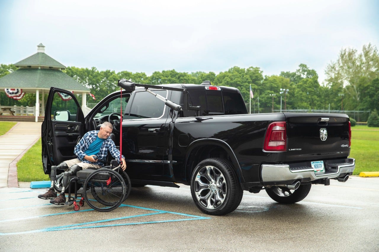 Turny Evo Turning Transfer Seat in use with Scooter Lift