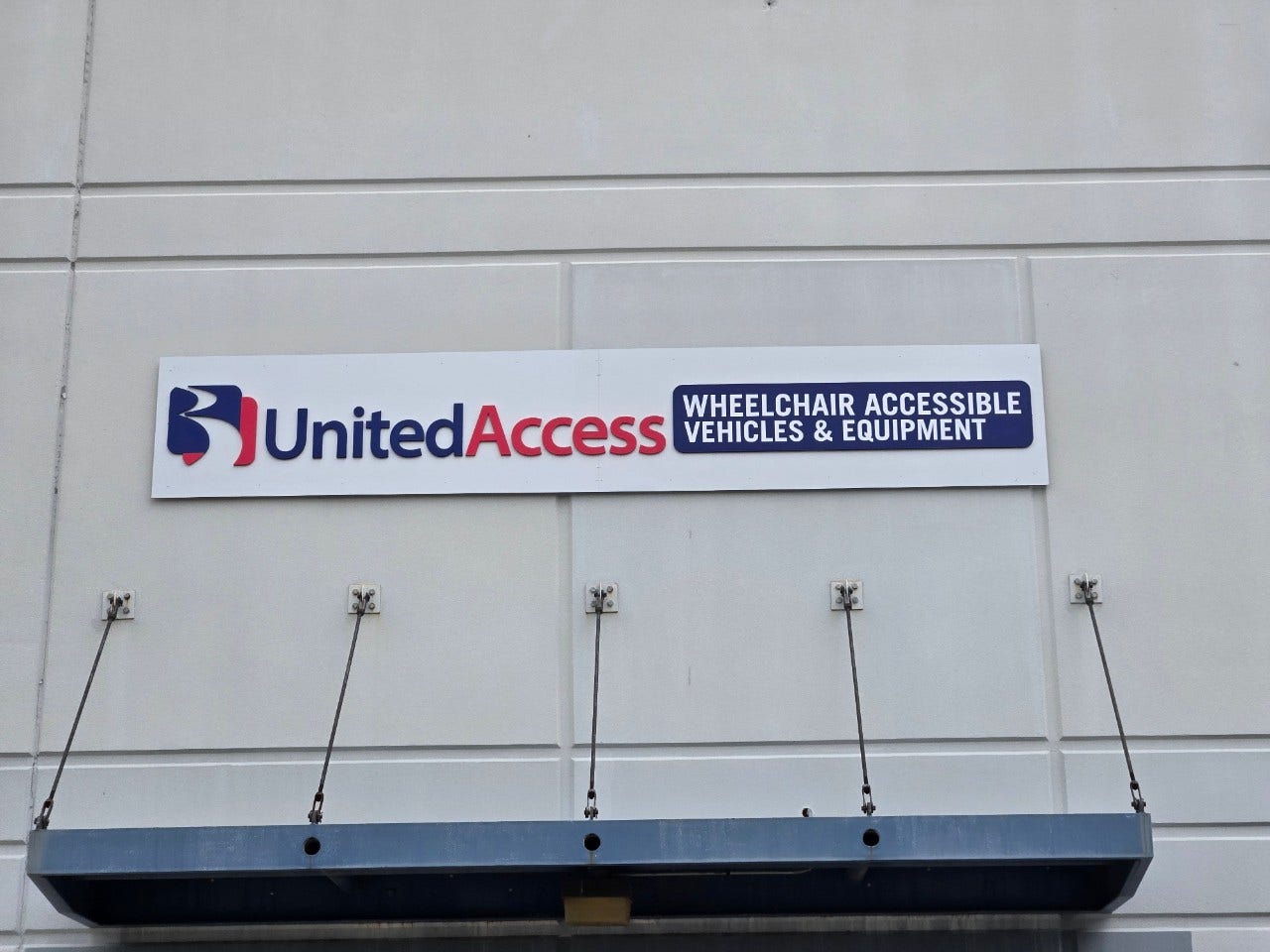 United Access logo on front of building