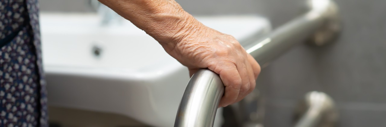 home accessibility solutions and modifications woman holding on to handrail