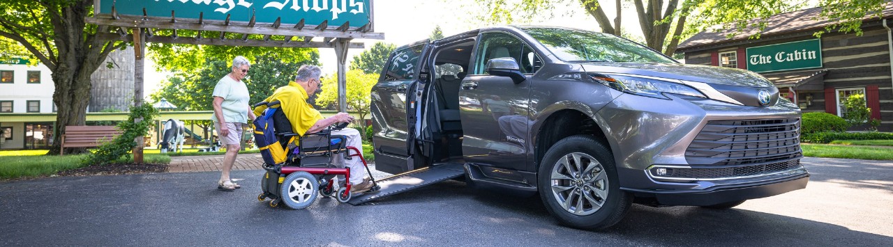 man using mobility scooter rental entering a wheelchair accessible vehicle