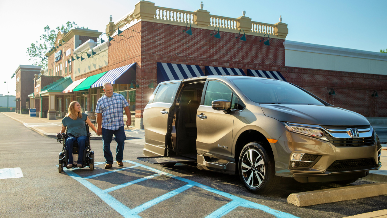 Man and Women entering a Handicap Van