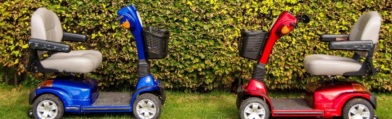 red and blue mobility scooters