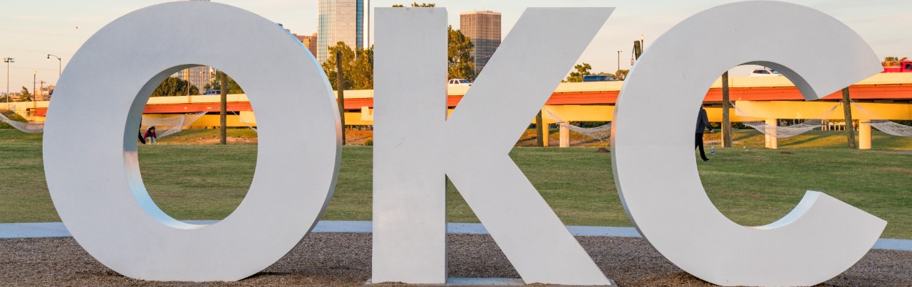 Skyline of Oklahoma City, OK with OKC sign