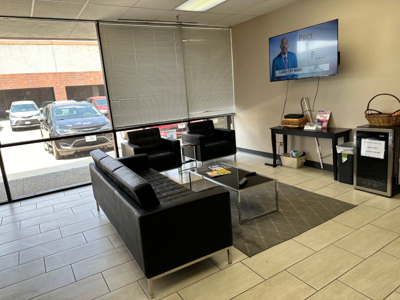 waiting area with couches and tv