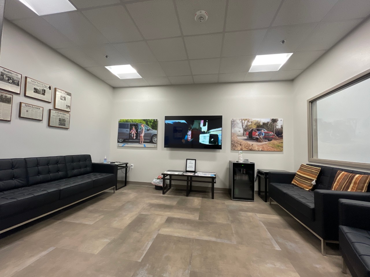 waiting area with couches and tv
