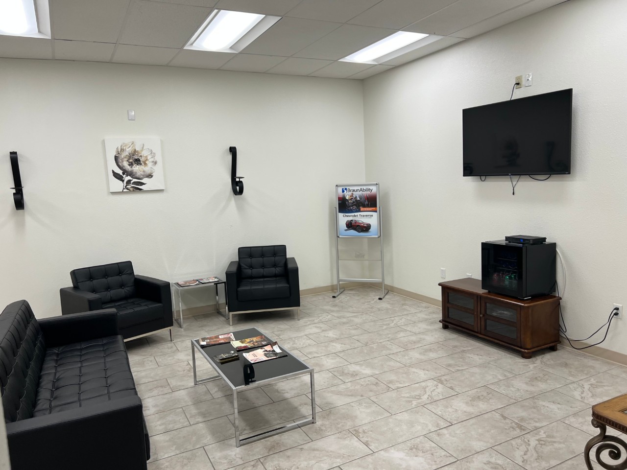 waiting area with couches and tv