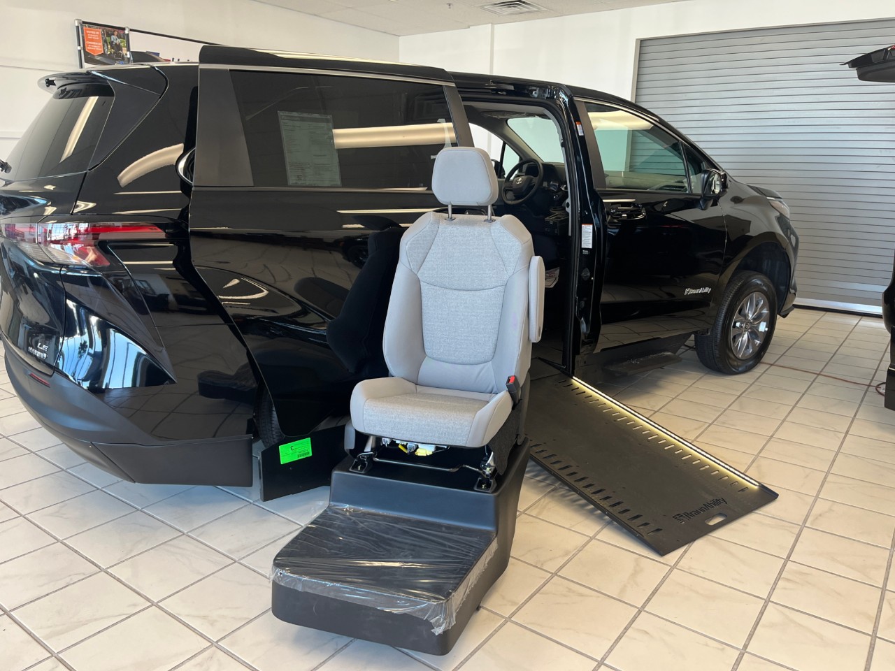 turny seat and wheelchair accessible van with ramp deployed