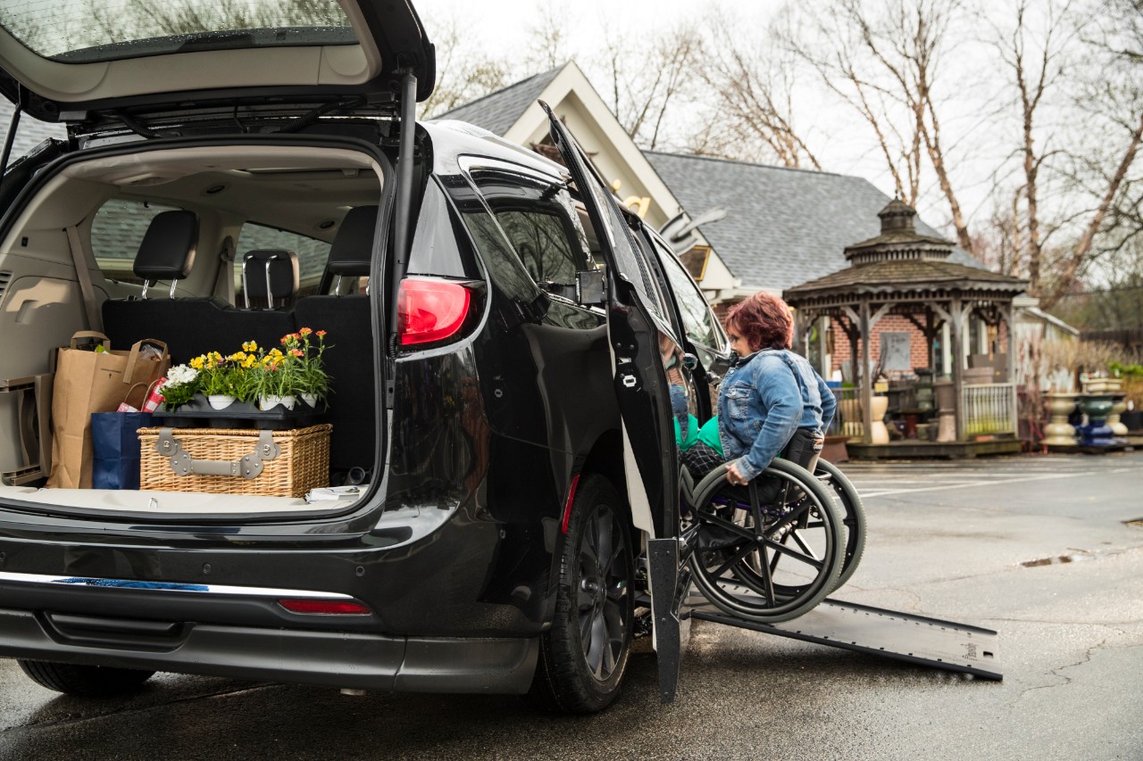 women entering a wheelchair accessible van ramp