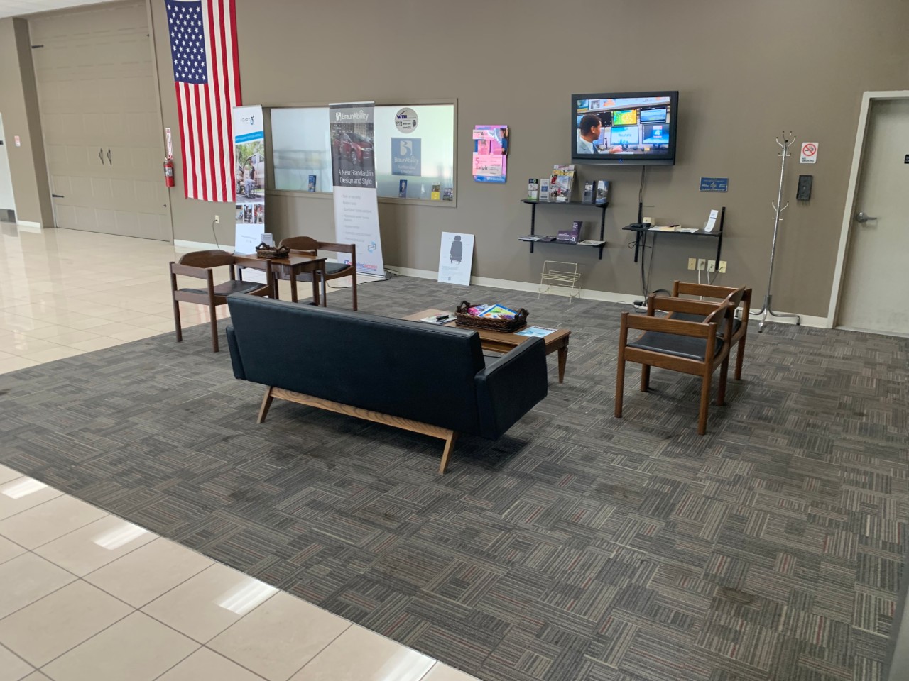 waiting area with couches and tv