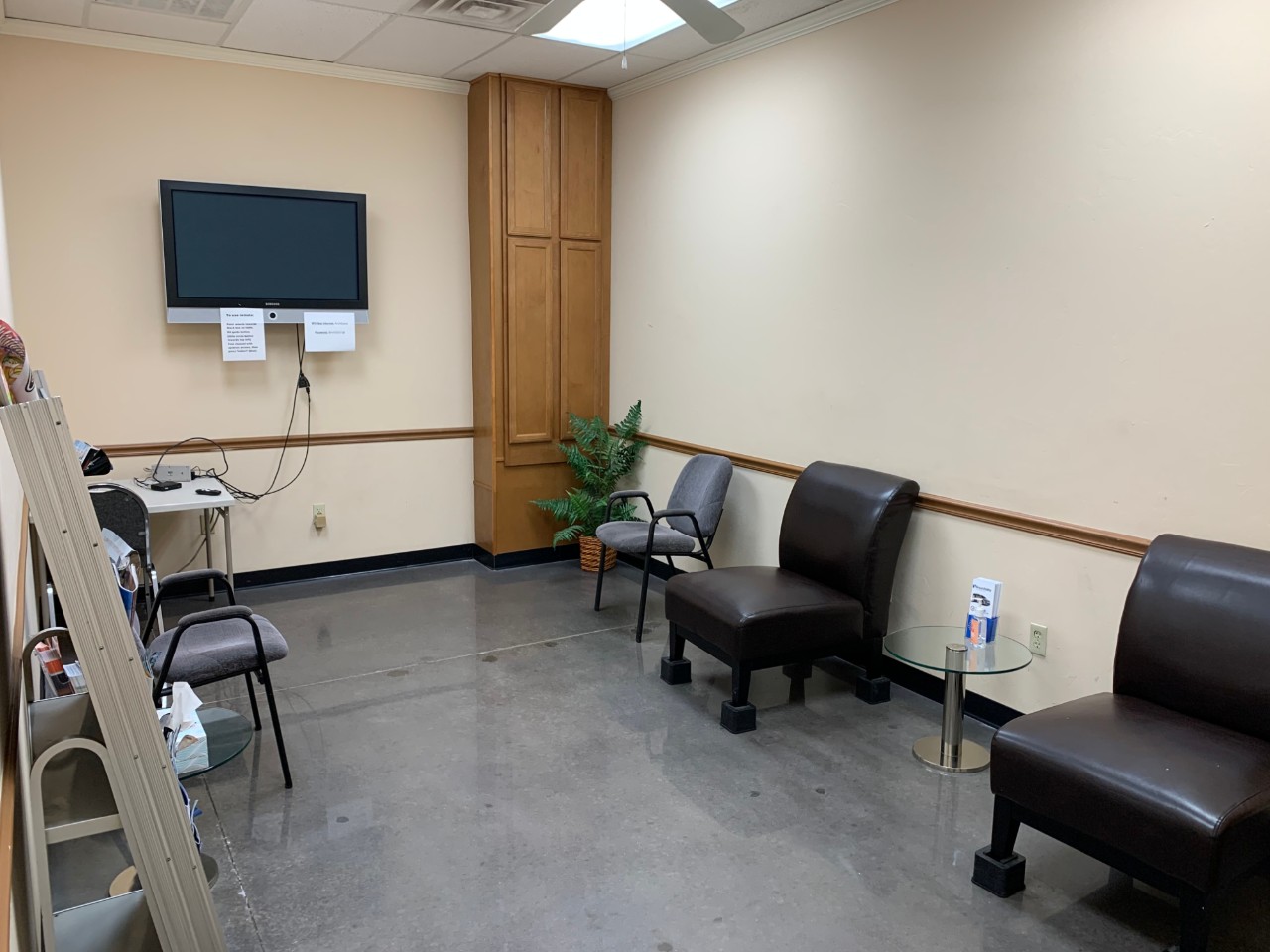 waiting area with chairs and tv