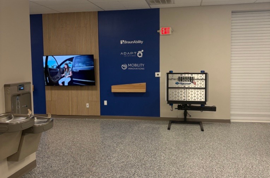wall with digital display, mobility partners and a lift