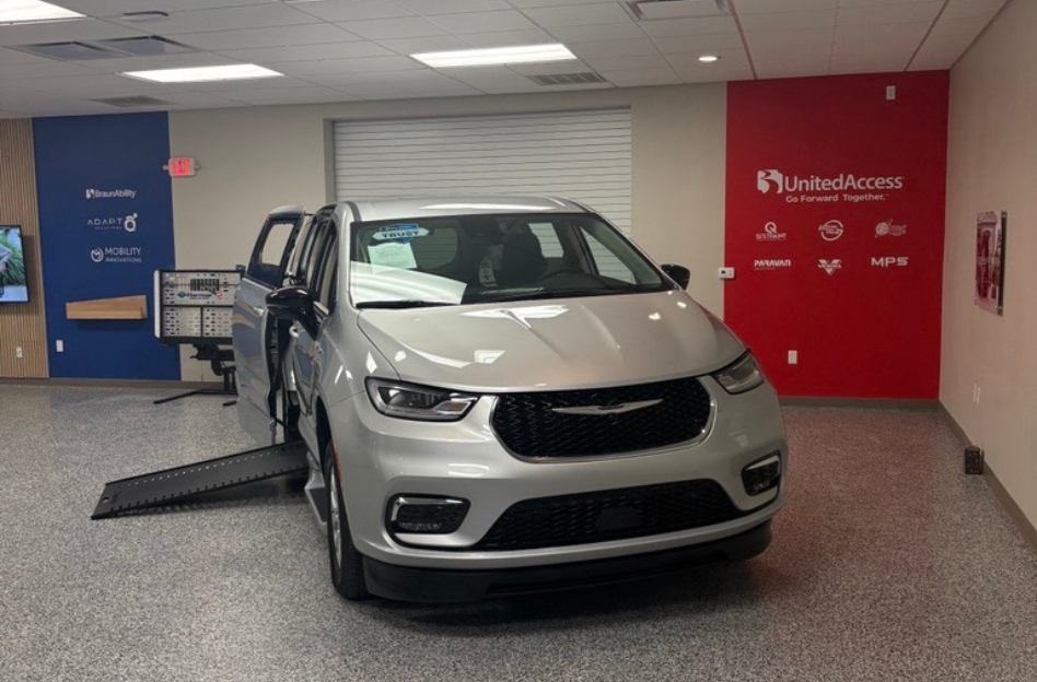 silver wheelchair accessible van with side-entry ramp deployed