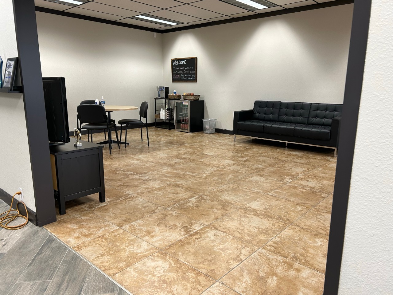 waiting area with couches and tv