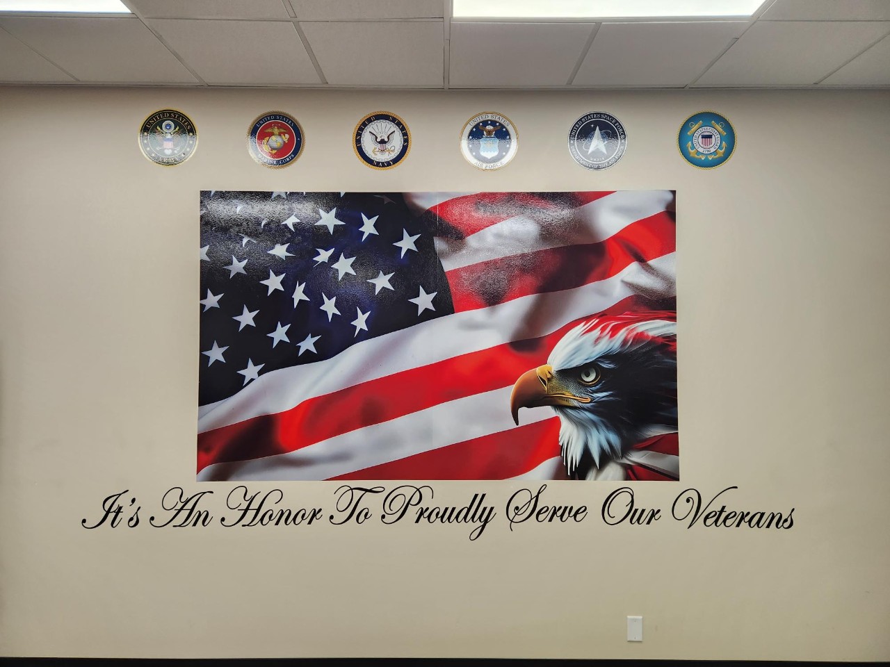 American flag and veterans wall