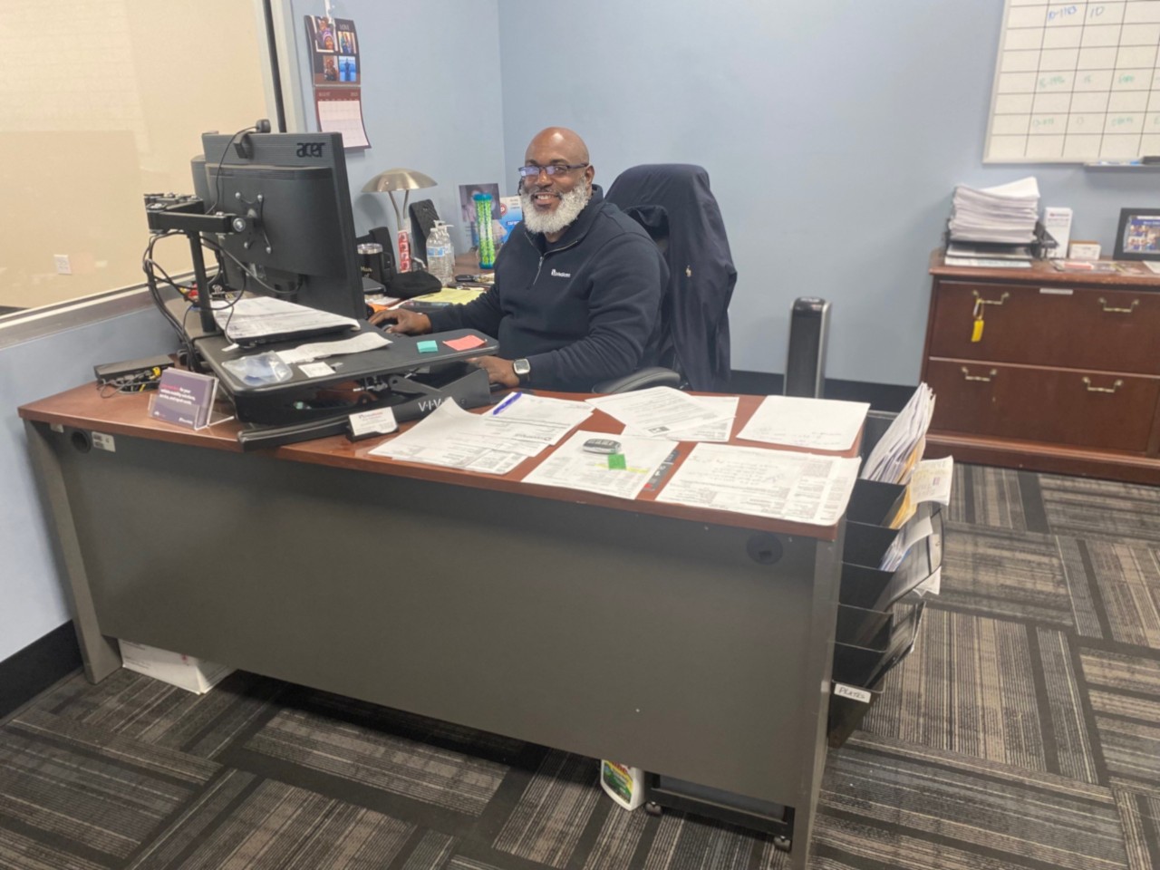 mobility specialist sitting at desk