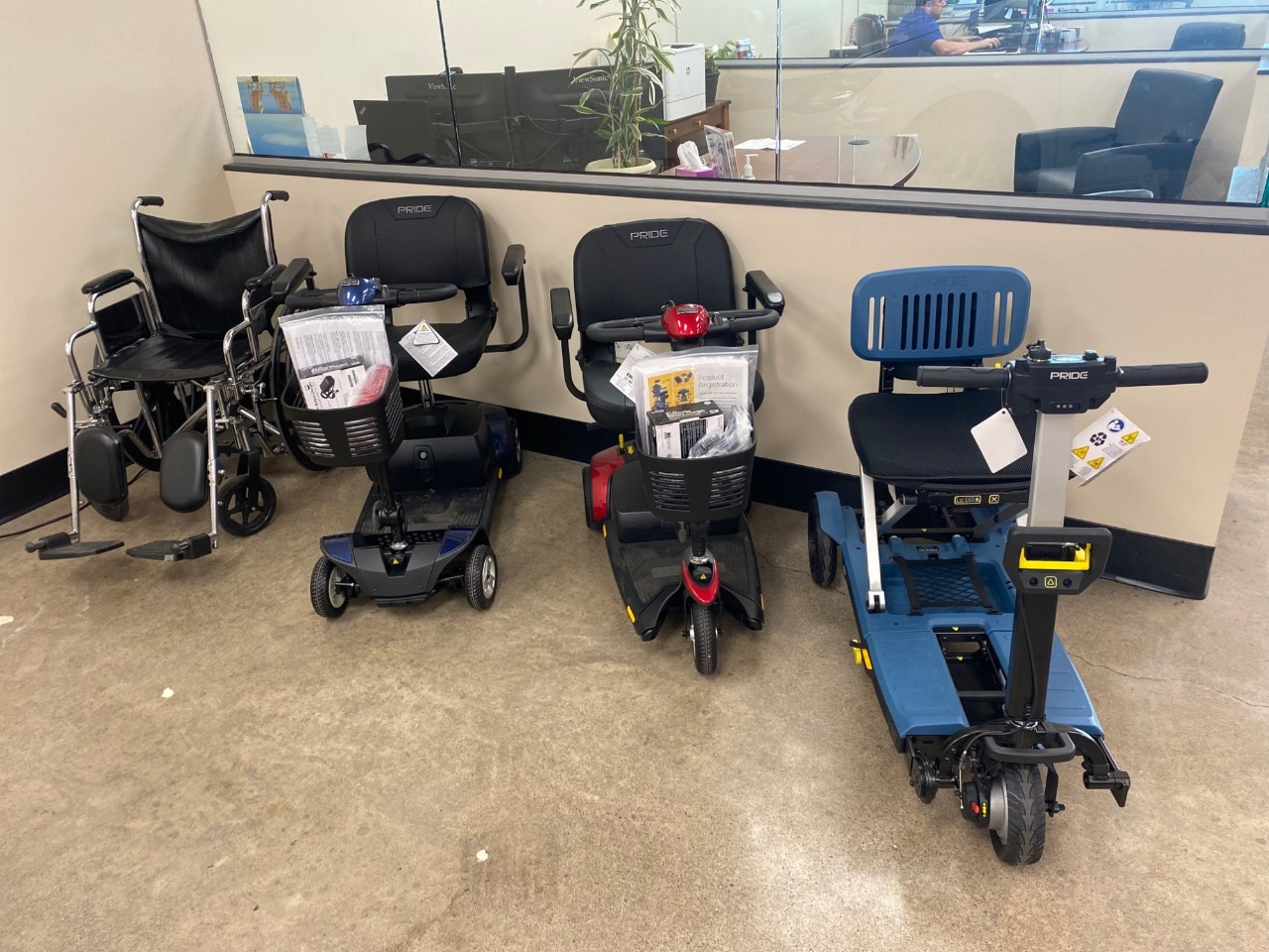 three mobility scooters