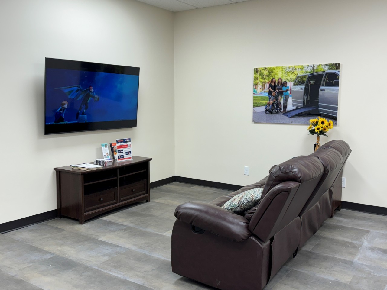 waiting area with couches and tv