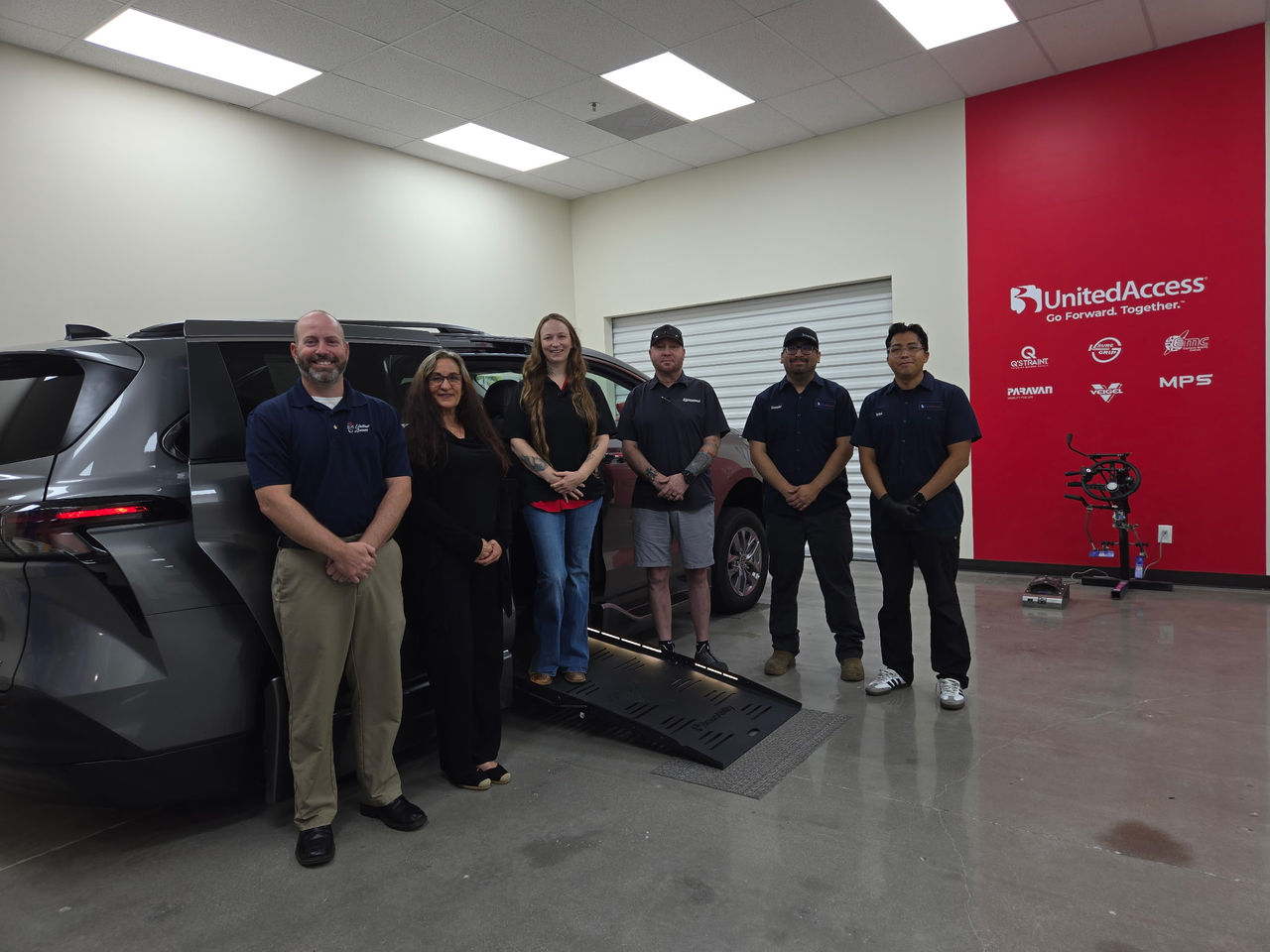 Mobility Specialists in Rowlett Texas in front of wheelchair accessible van