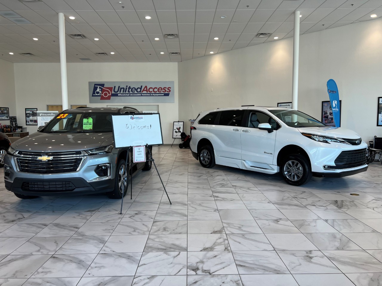 two wheelchair accessible vans in lobby