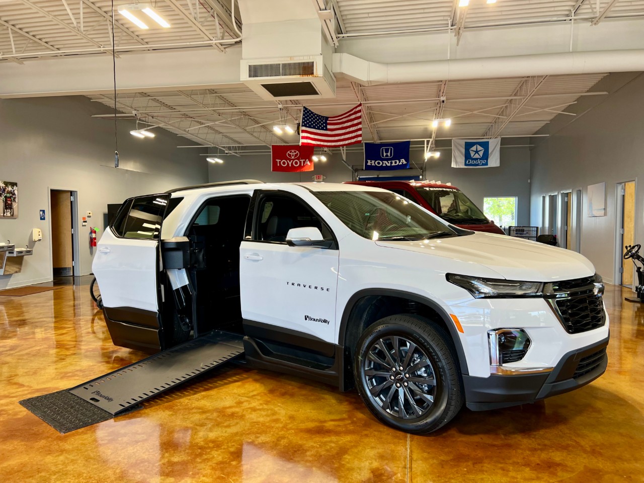 white accessible SUV with ramp deployed
