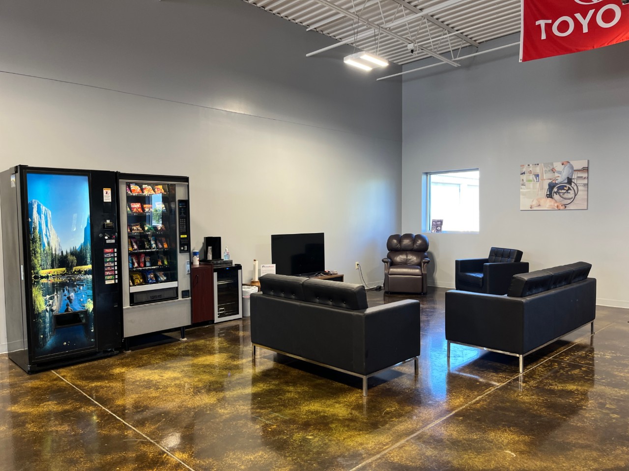 waiting area with couches and tv
