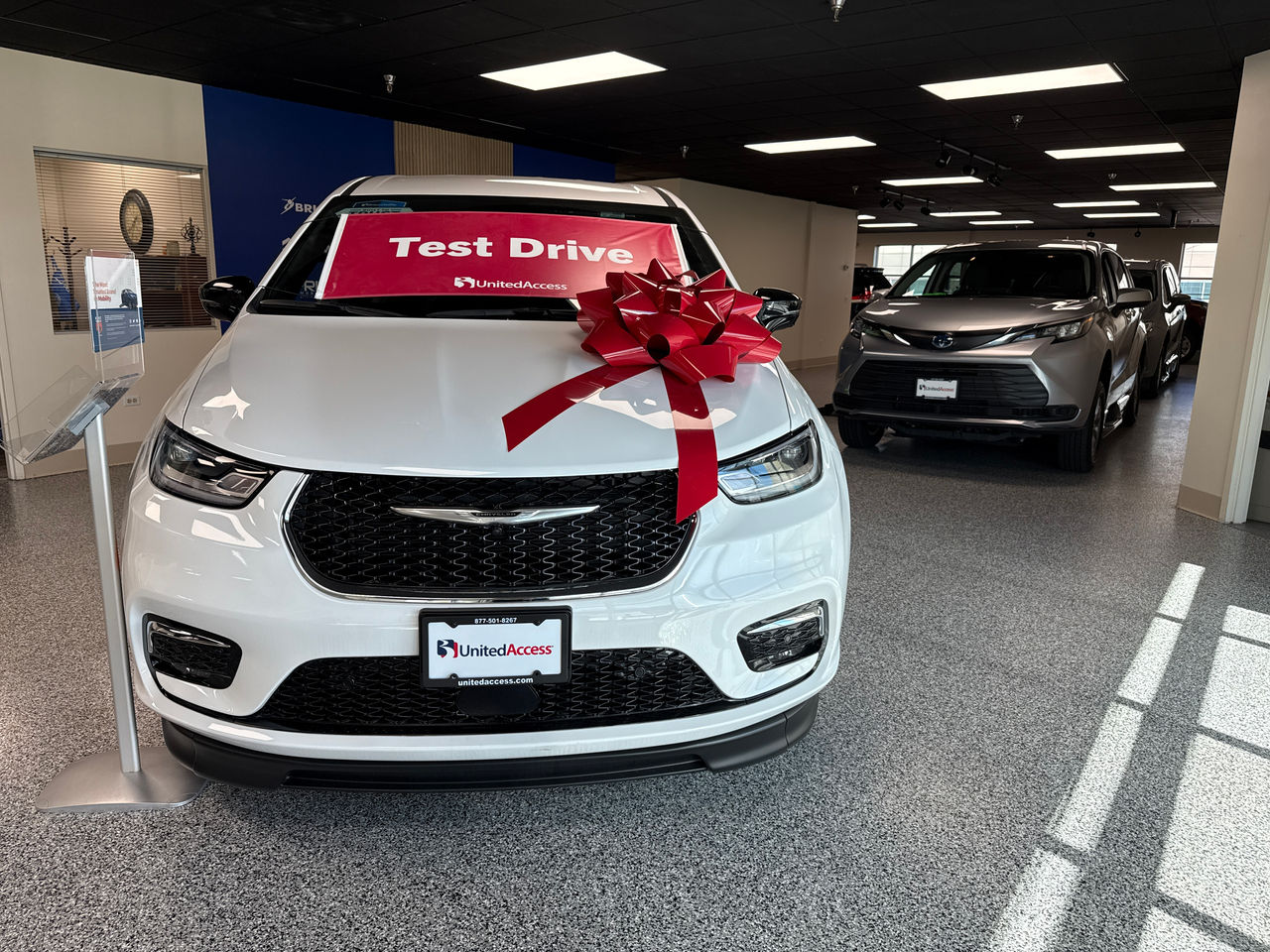 two wheelchair accessible vehicles in showroom