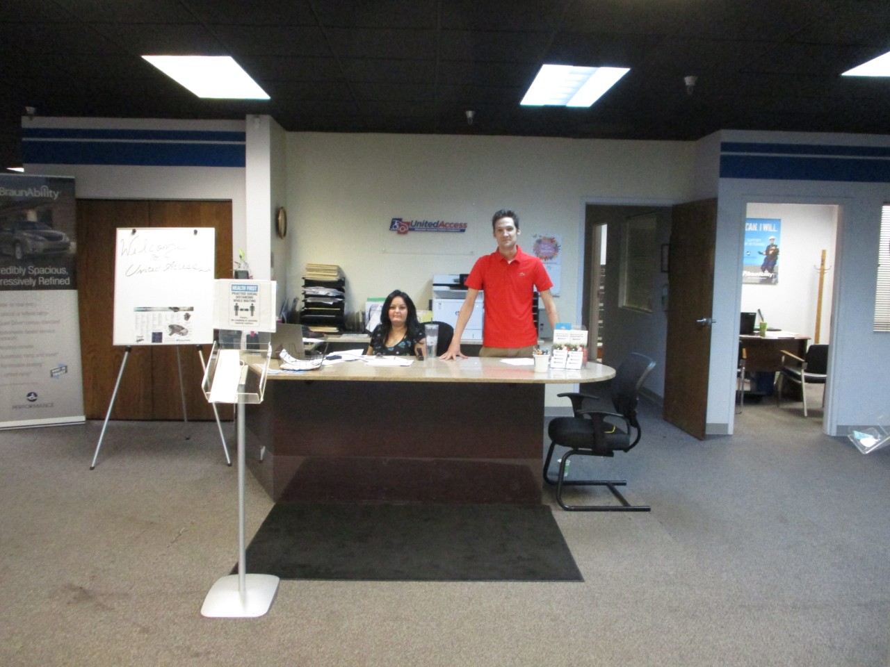 two team members at reception desk
