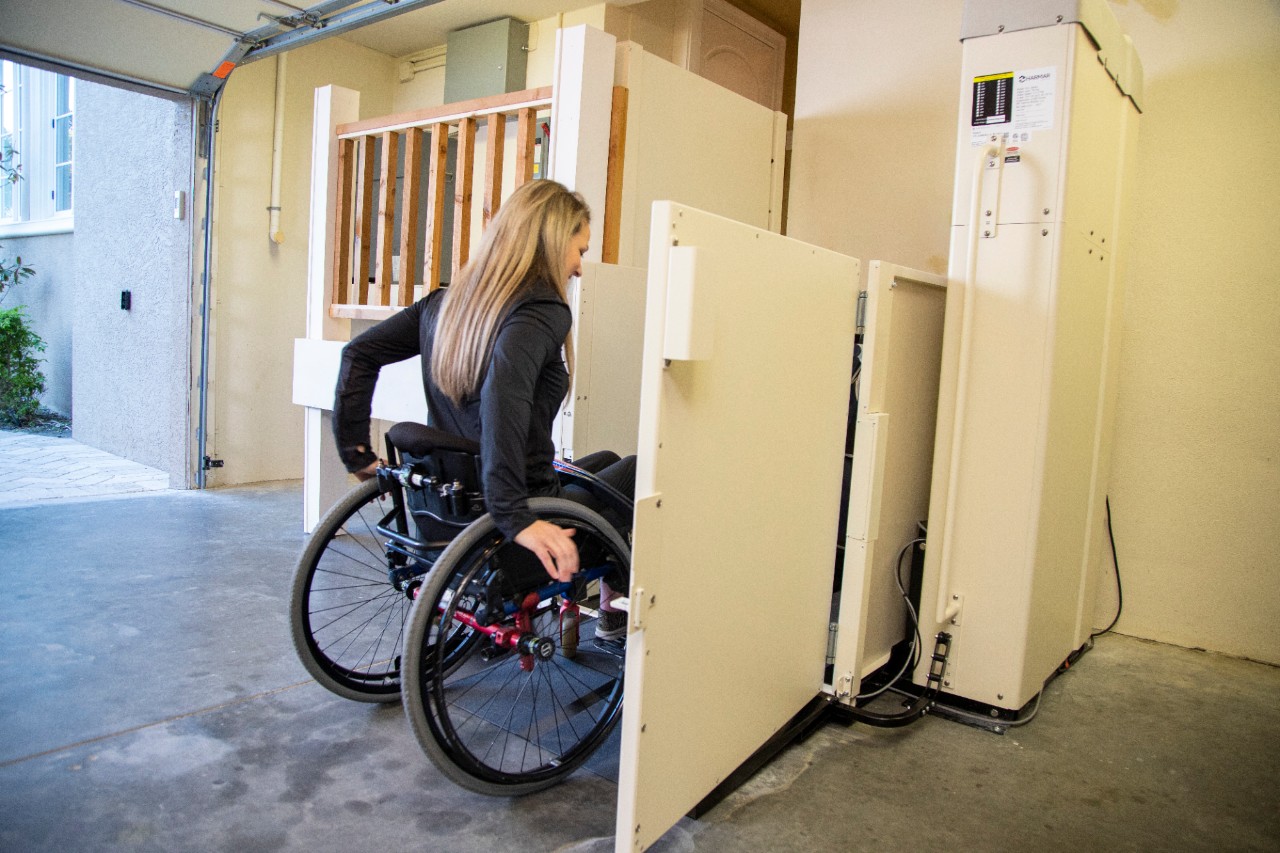 Harmar Highlander Vertical Platform Lift woman entering lift