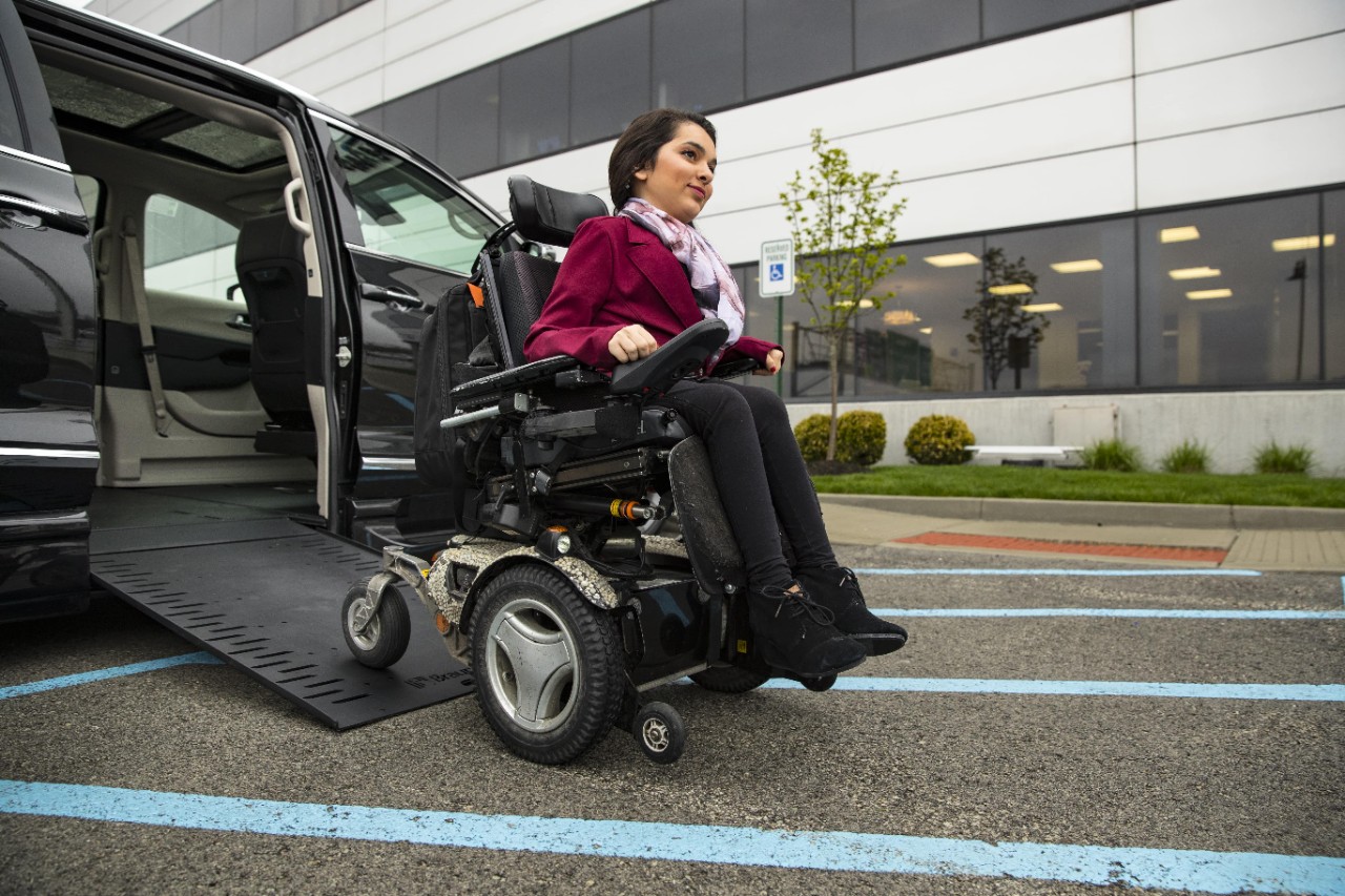 Chrysler Pacifica In-Floor XL Wheelchair Van Woman Using Ramp