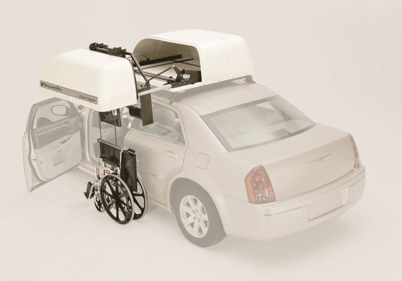 Molded plastic cover protects wheelchair from outside elements 