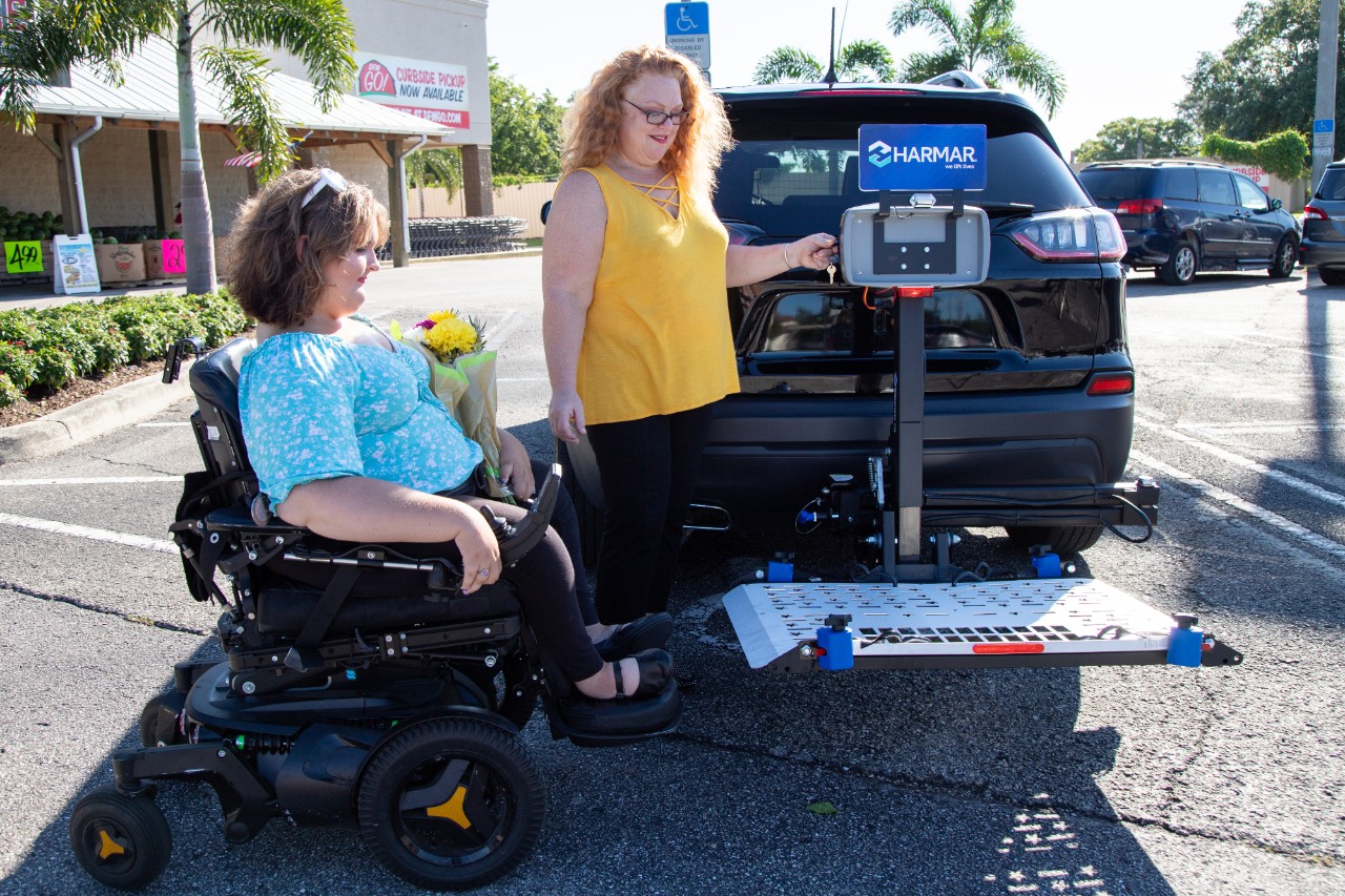 Harmar AL500 Scooter powerchair lift women with vehicle