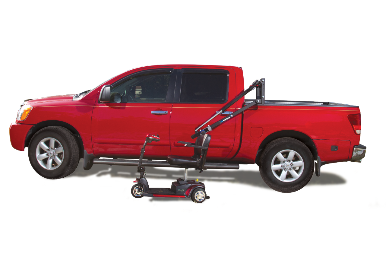 Harmar AL835 Scooter Powerchair Lift next to red truck