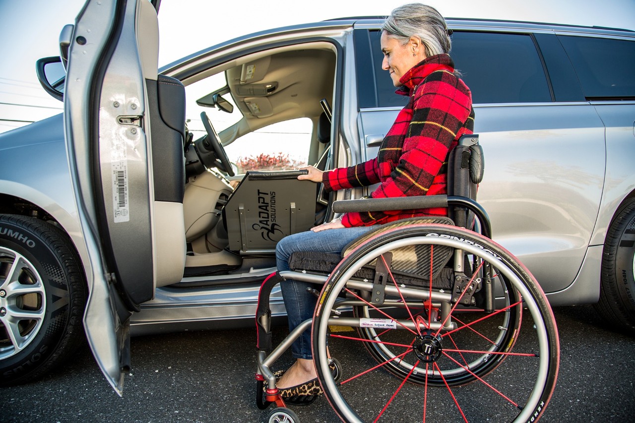 Affordable Transfer Board in use from wheelchair to transfer board