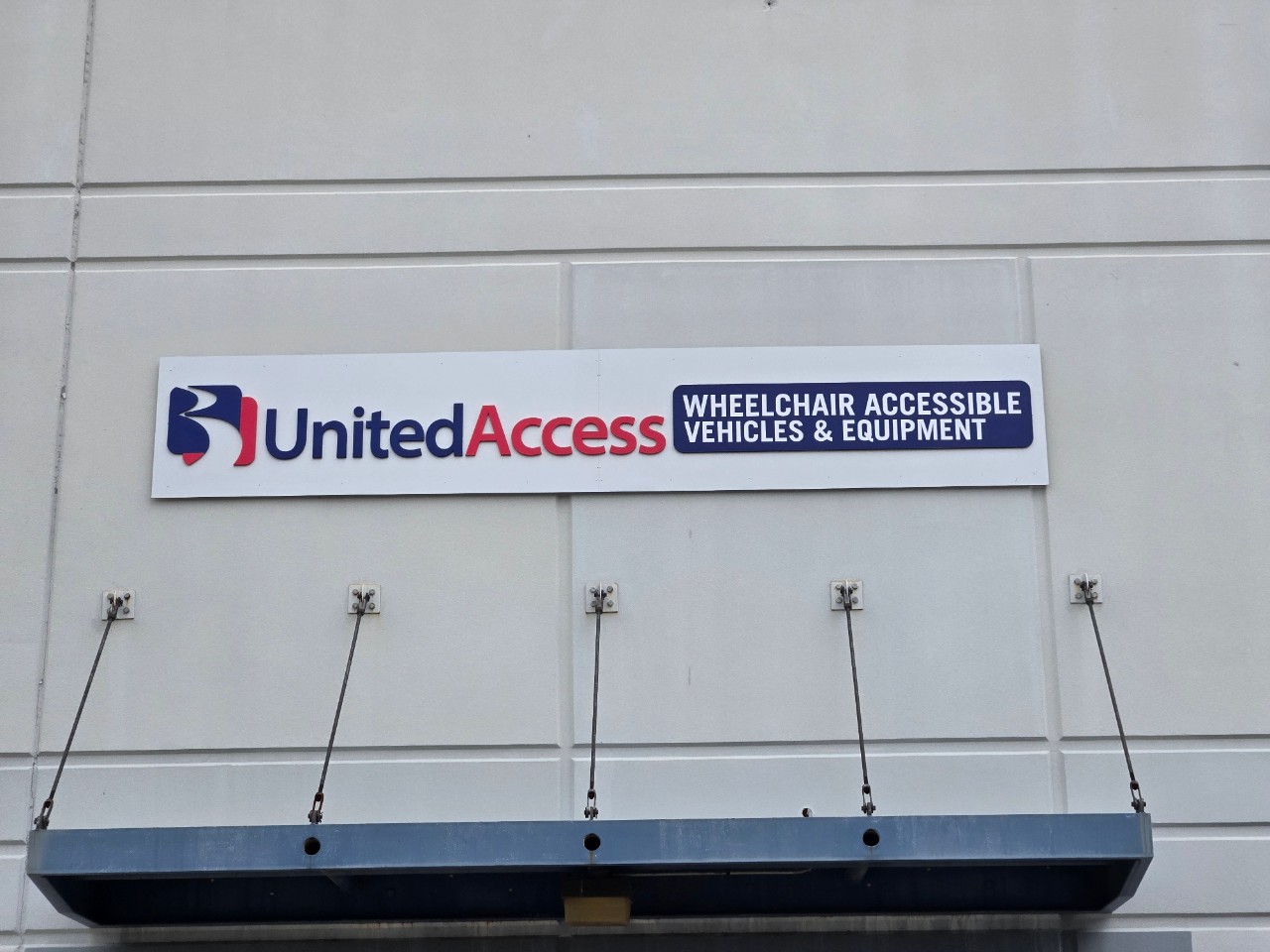United Access logo on front of building