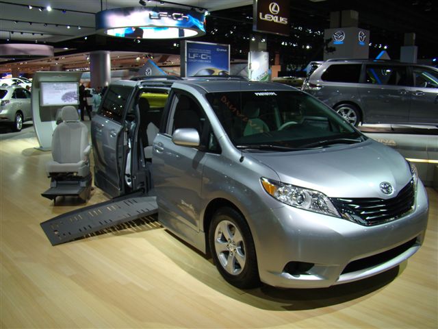wheelchair accessible van with side-entry ramp deployed at Abilities Expo